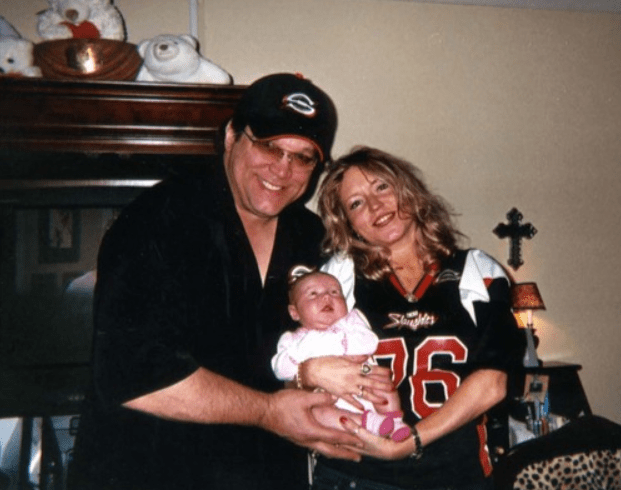 Steve McMichael and his wife with their child